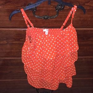 Pretty orange polka dot top.